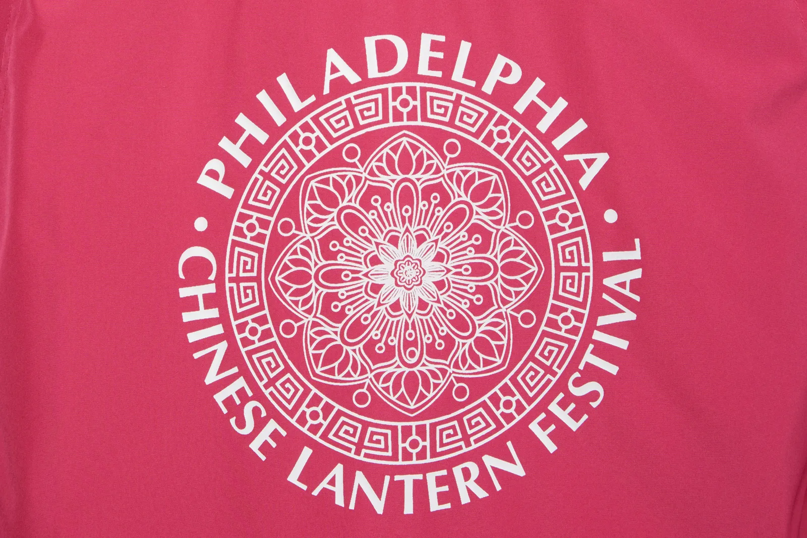Screen-printed white graphic on a pink shirt